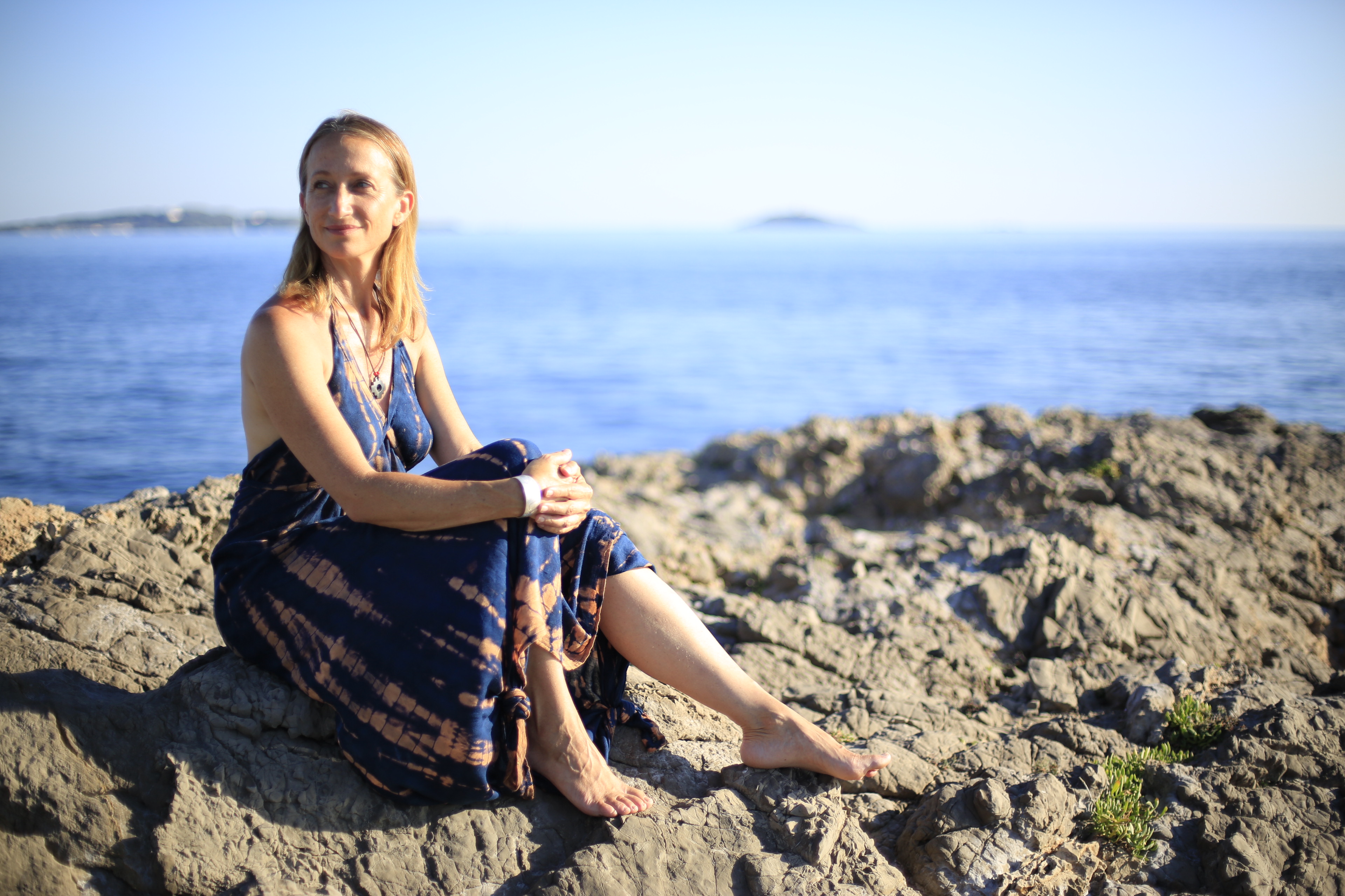 Celine Cousteau sitting on cliffs