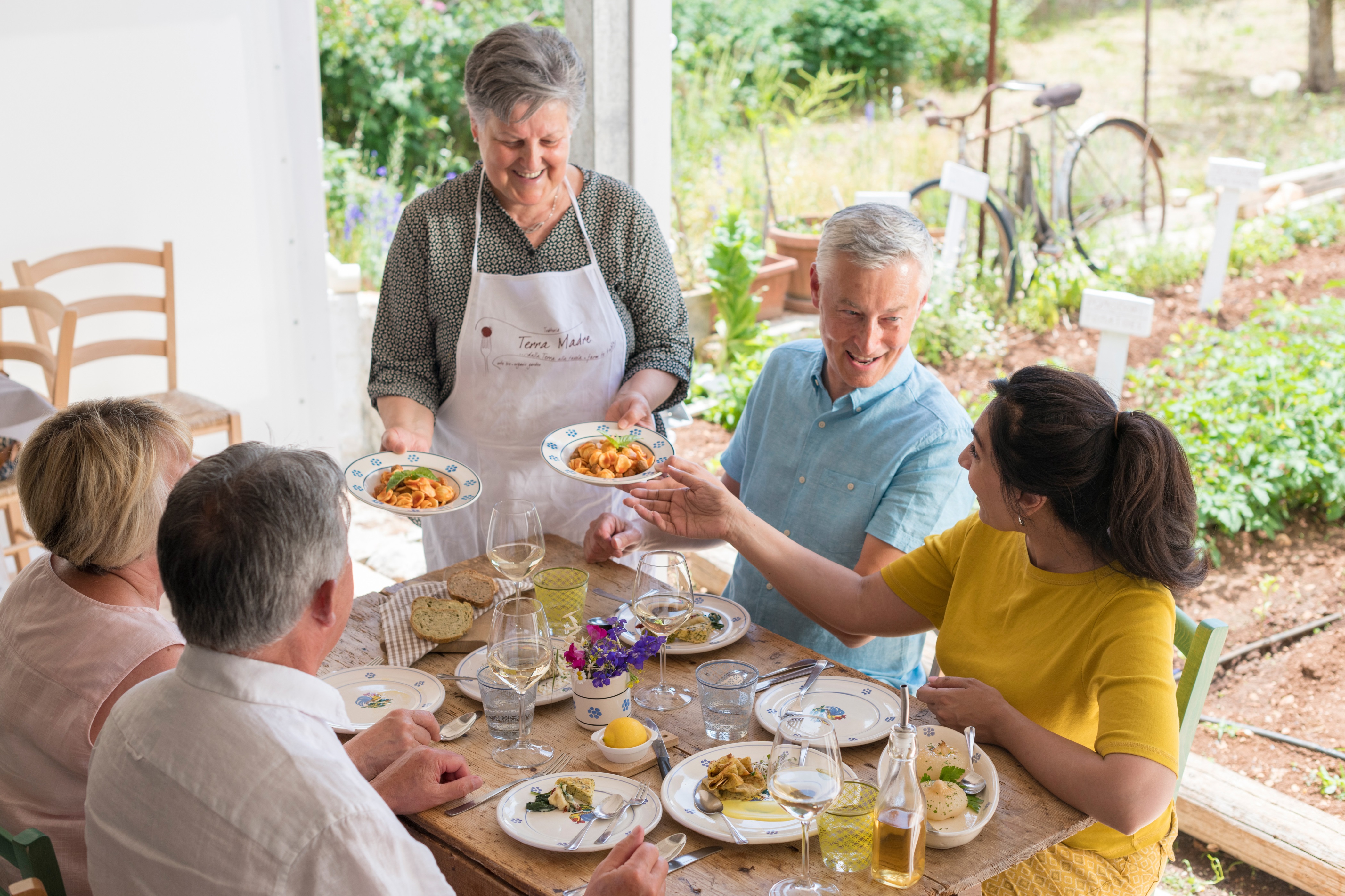 A group of people tasting local dishes