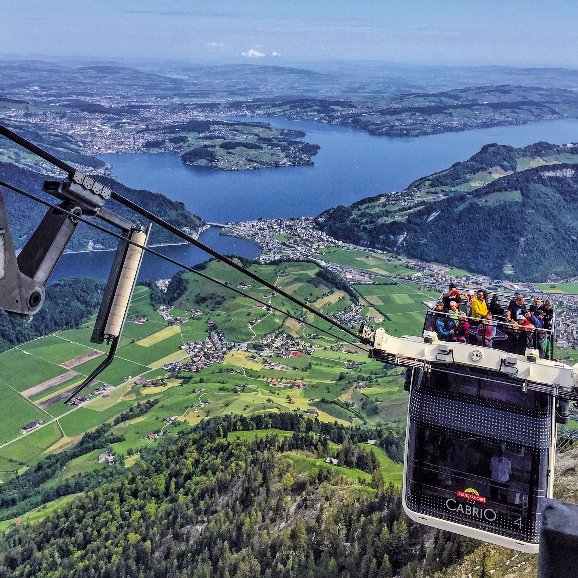 Open top cable car making its way up the mountain in Switzerland