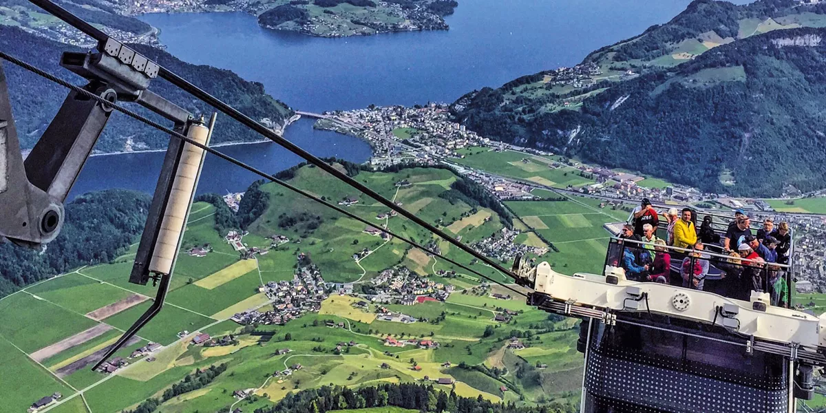 Open top cable car making its way up the mountain in Switzerland