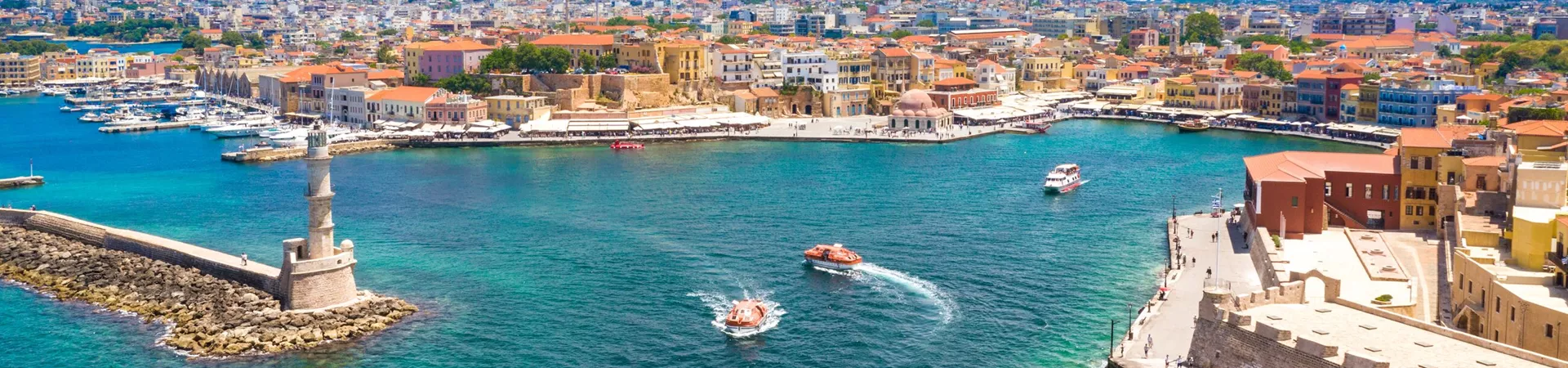 Aerial view of the beautiful city of Chania with it's old harbor and the famous lighthouse, Crete, Greece