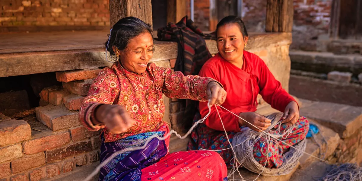 Two Nepali women spinning wool in Bhaktapur, Nepal