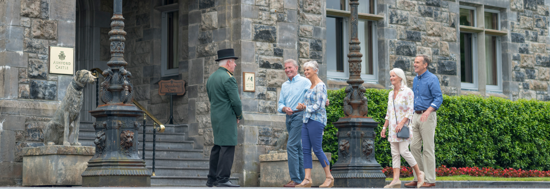A group of tourists entering the Ashford Castle.