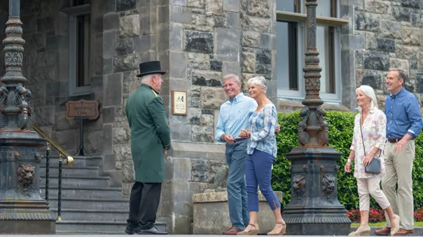 A group of tourists entering the Ashford Castle.