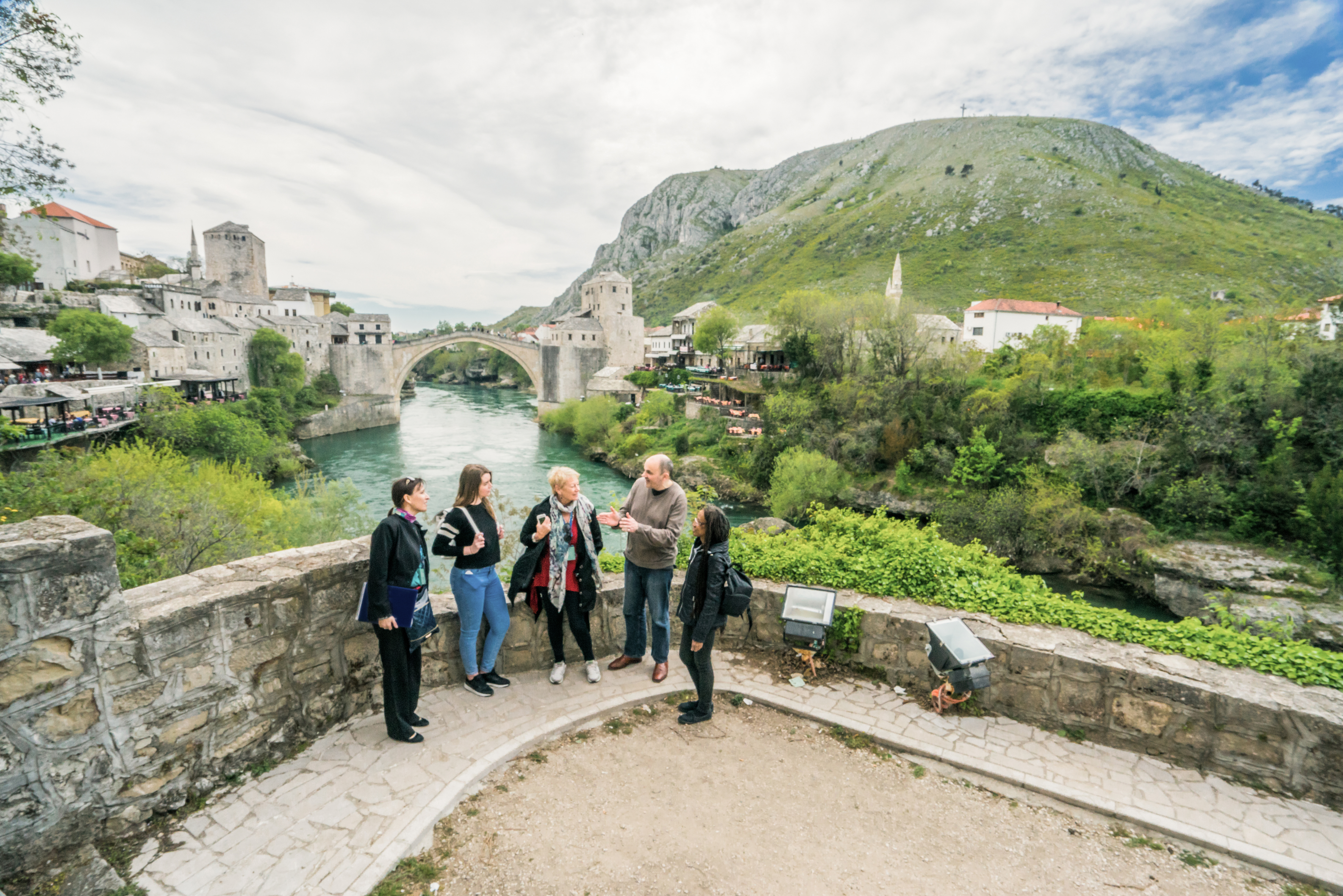 Tourists standing over the river