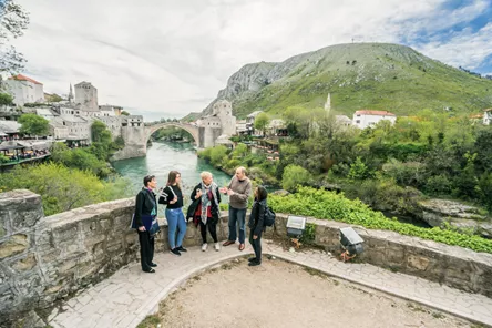 Tourists standing over the river