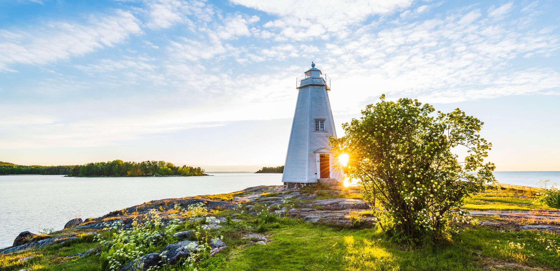 Sun setting on a traditional light house in Sweden, Scandinavia
