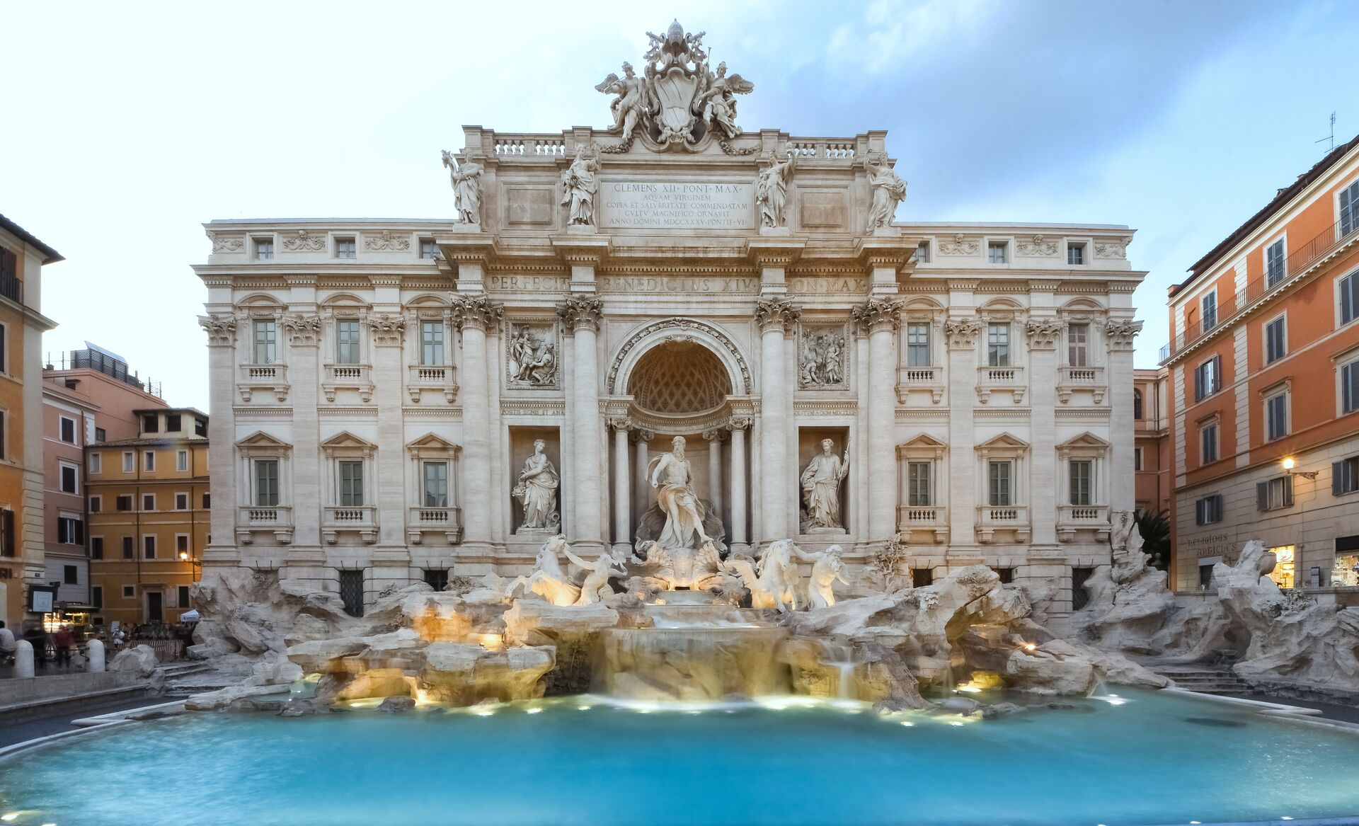 Trevi Fountain illuminated at dusk in Rome, Italy