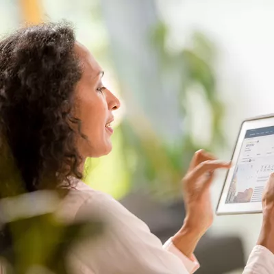 Woman sat, relaxing while requesting a quote on the Insight Vacations website