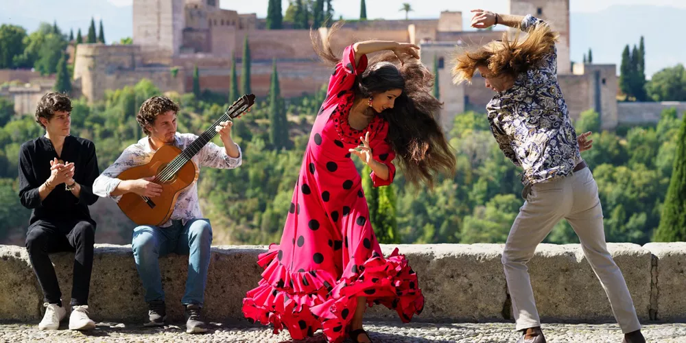 Musician and Dancers performing Flamenco outside the Alhambra in Granada, Spain