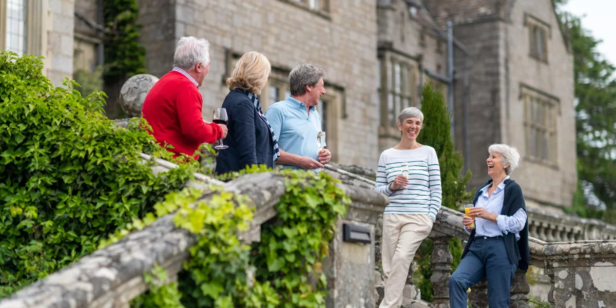 Guests enjoying drinks at Bovey Castle in Devon, England, UK