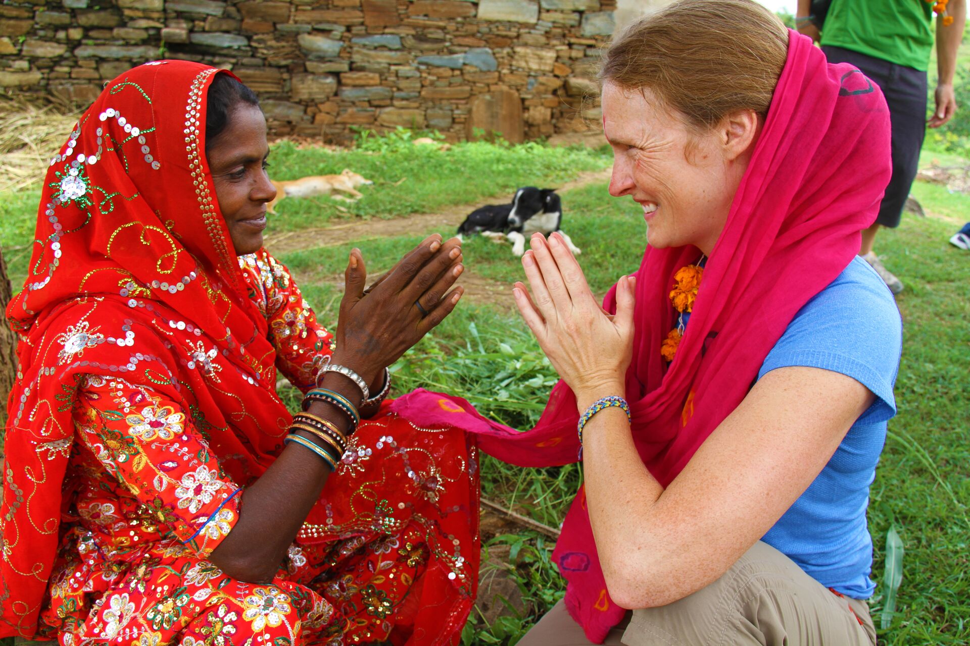 A tourist interacting with an Indian woman