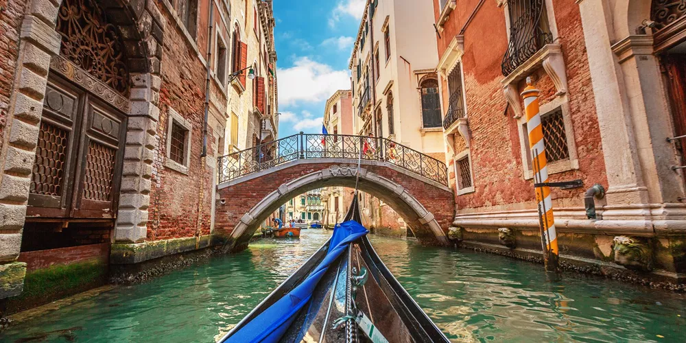 View from a gondola during a ride through the canals of Venice, Italy