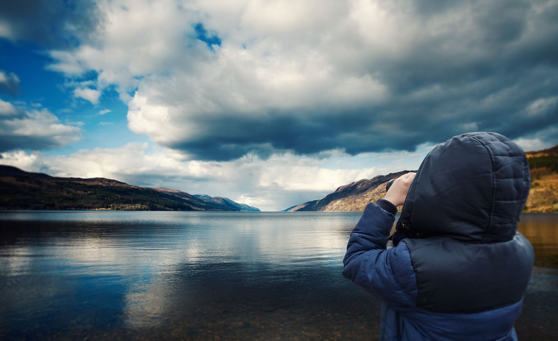 A child searching for Loch Ness in the Scottish Highlands