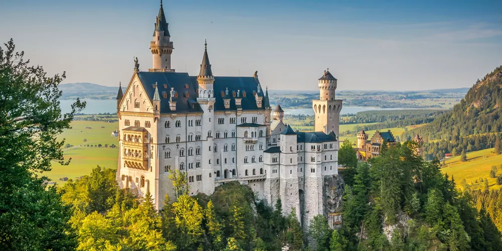 Neuschwanstein Castle with mountains behind Near Fussen, Germany