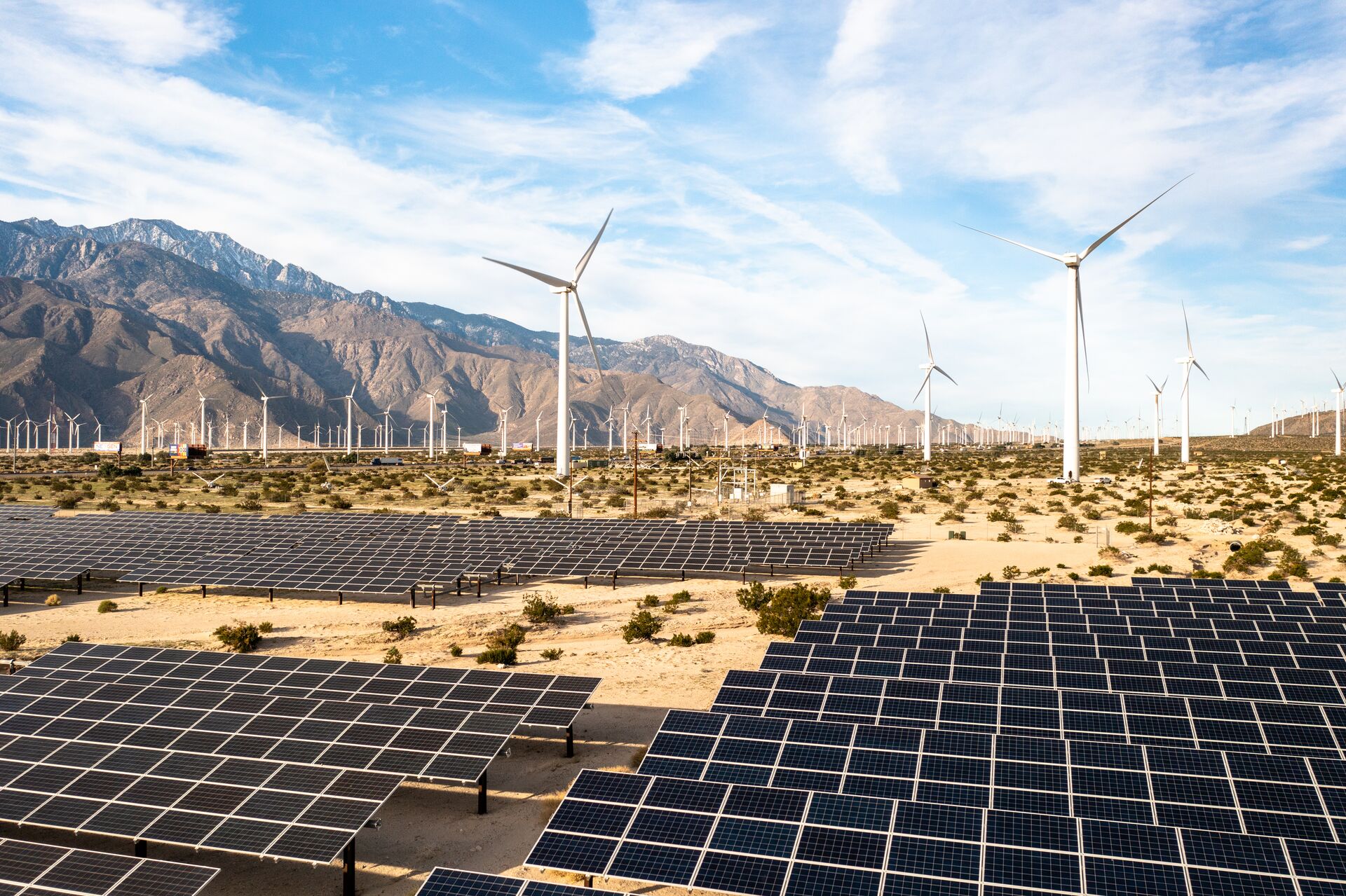 Large Aerial View Over Solar Panels And Windmills 1367402534