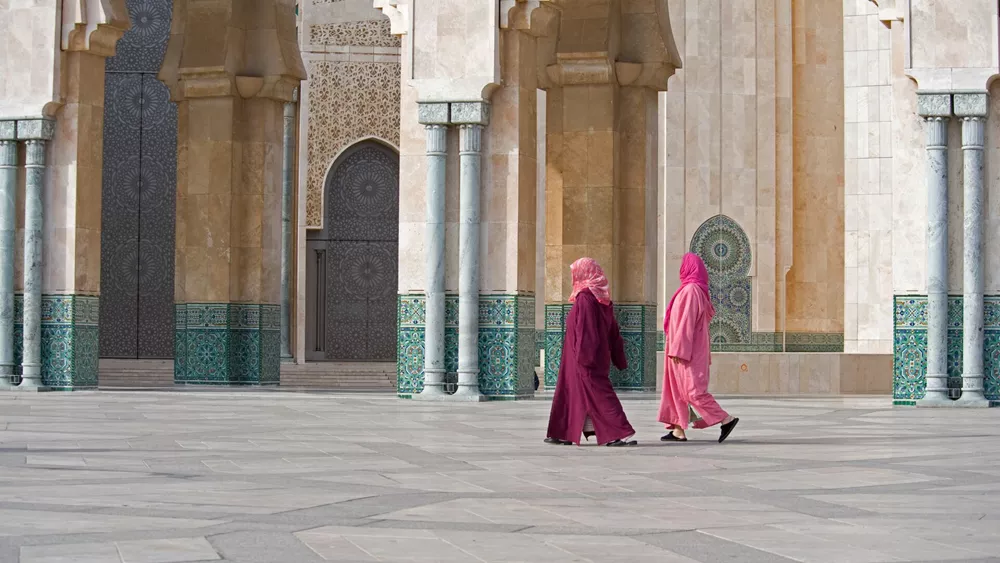 Two Women Walk In Hasan II Mosque In Casablanca, Morocco
