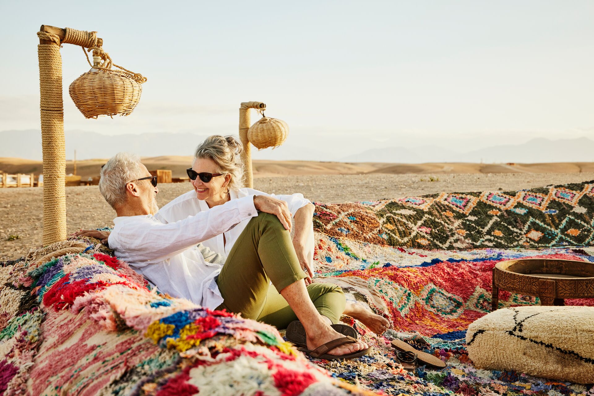 Couple relaxing in a Berber camp in the Sahara Desert, Morocco