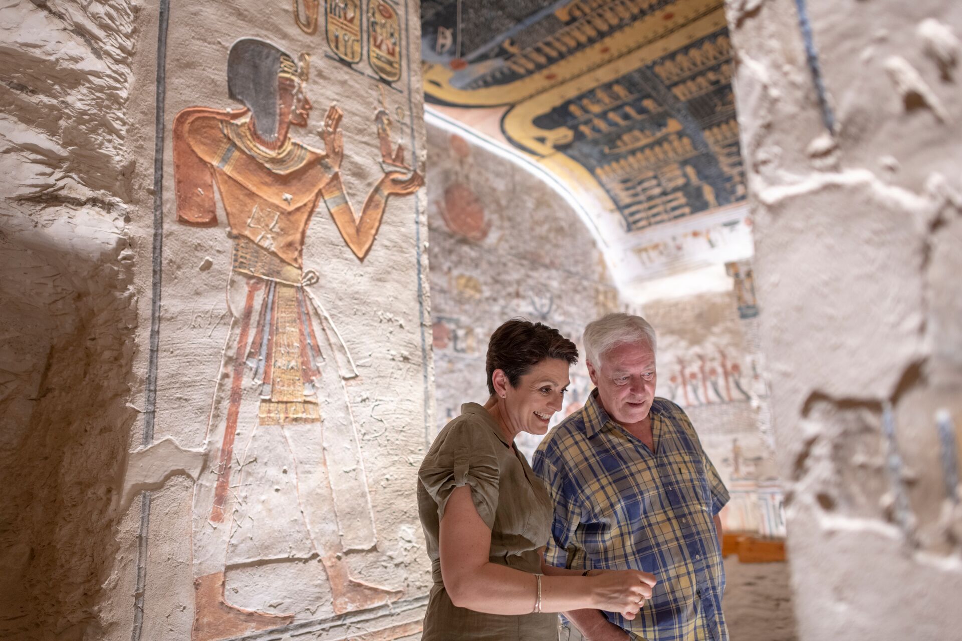 Guests looking at Hieroglyphics at Ramesses VI Tomb in Luxor, Egypt