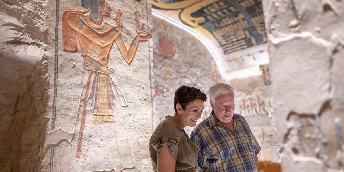Guests looking at Hieroglyphics at Ramesses VI Tomb in Luxor, Egypt