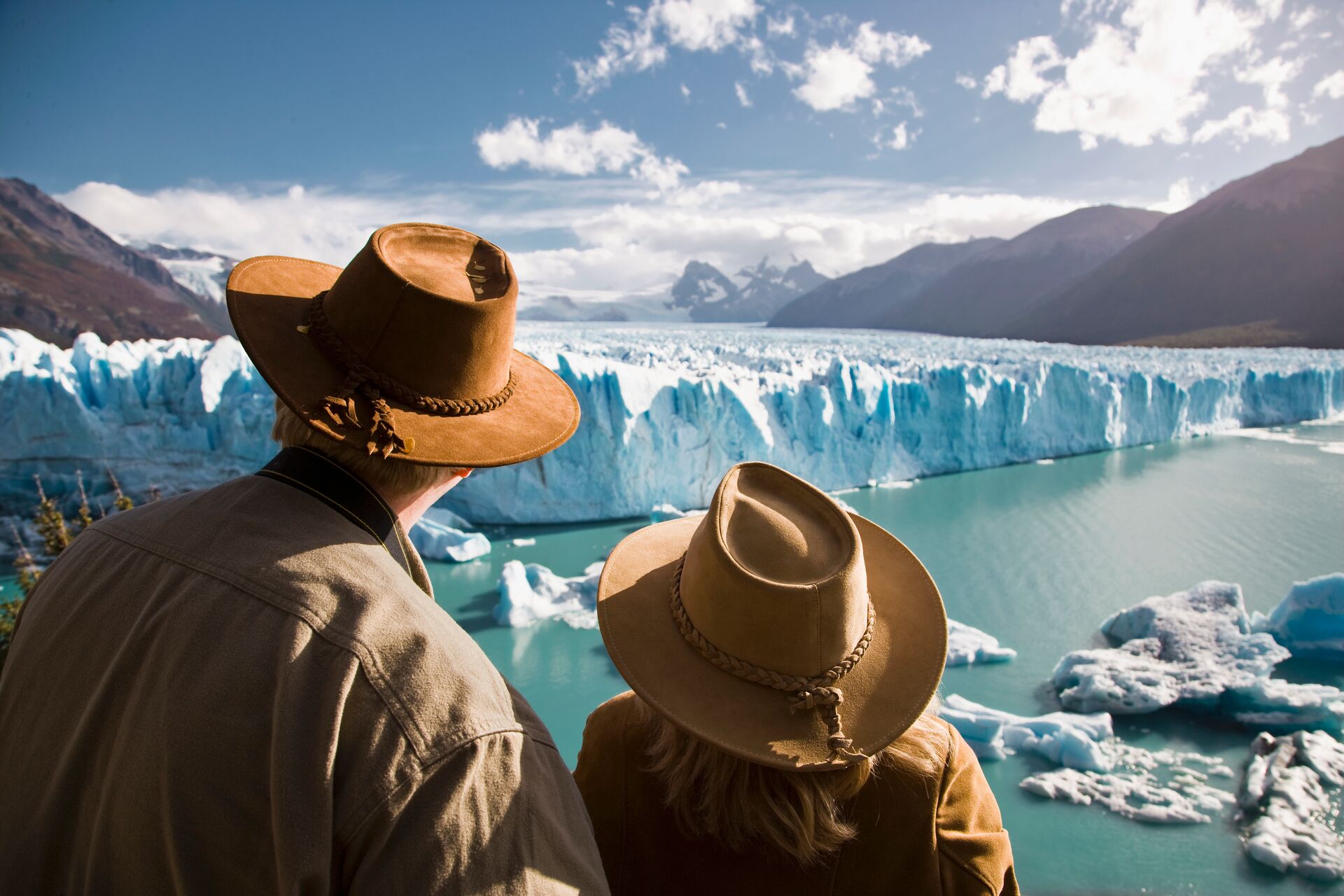 Couple looking at a glacier in Argentina, South America