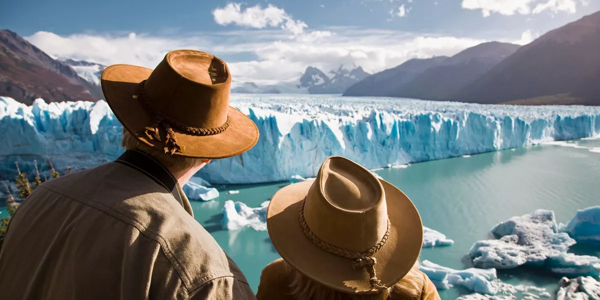 Couple looking at a glacier in Argentina, South America
