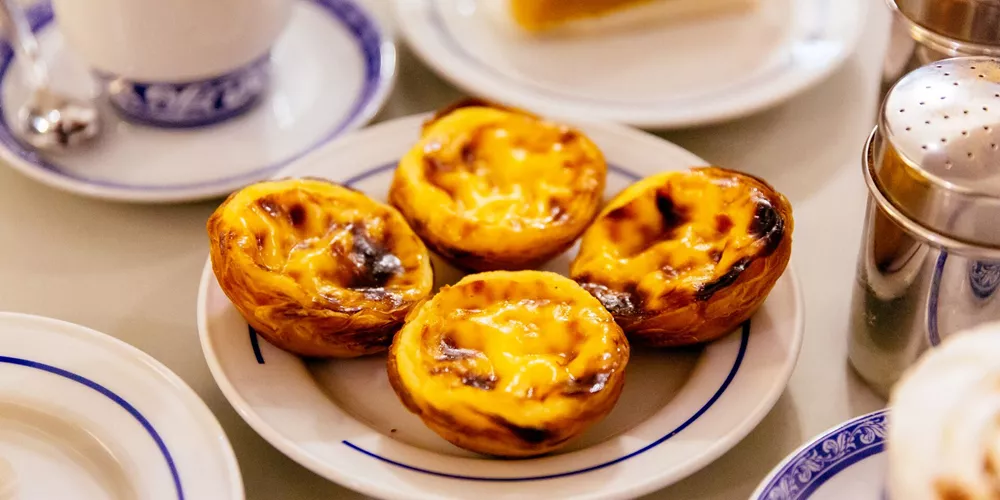 Pasteis De Nata, a traditional Portuguese pastry on a plate