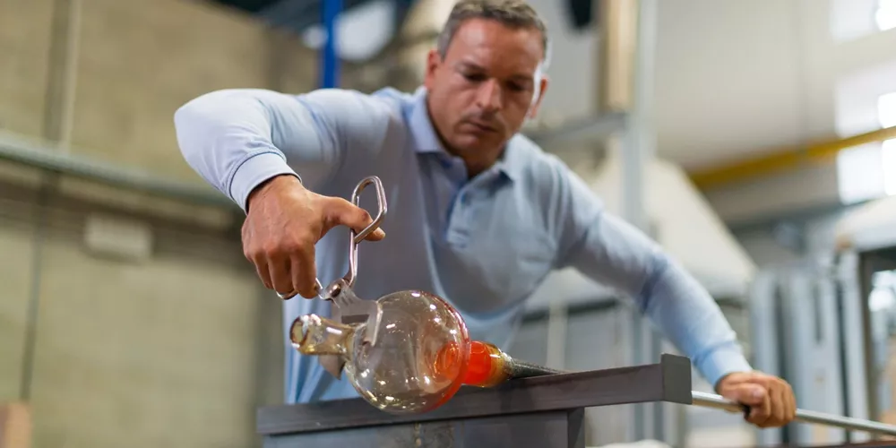 Man blowing traditional Murano Glass in Venice, Italy