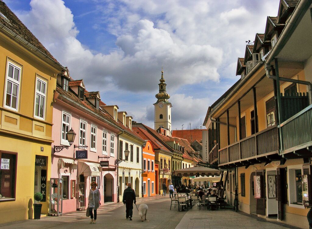 People Walking On Street Amidst Buildings in Zagreb, Croatia