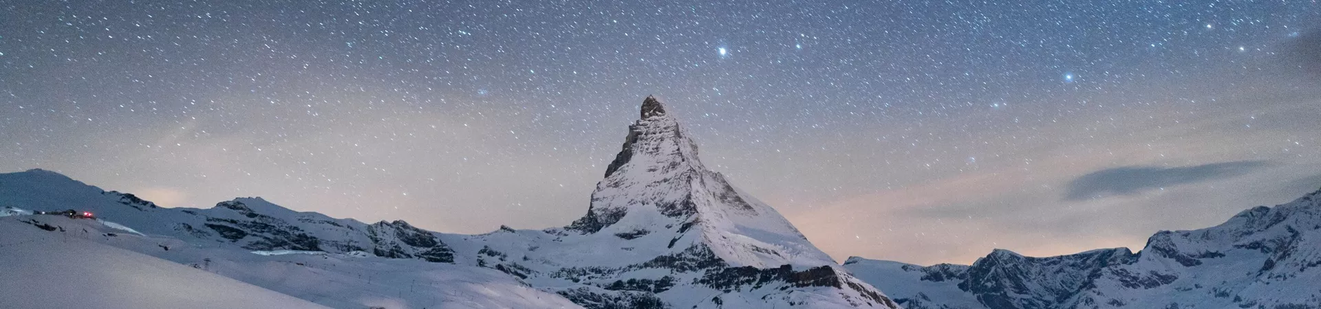The majestic Matterhorn in Zermatt, Switzerland with a clear night sky above it