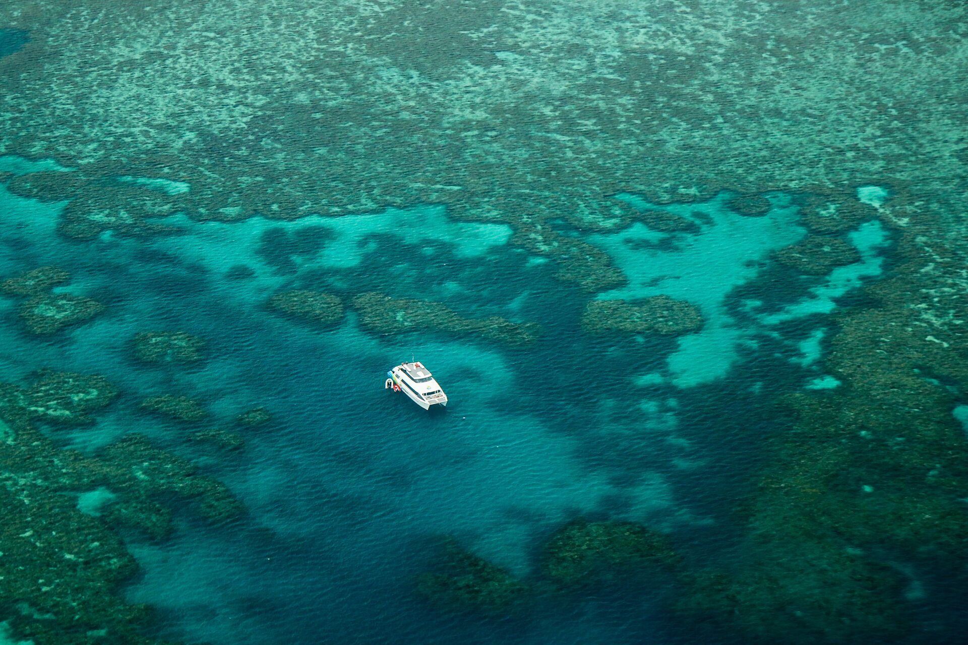 Boat floating in the Great Barrier Reef, Australia