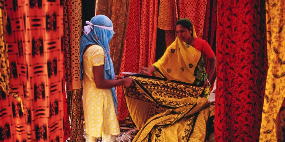 Indian woman selling printed material