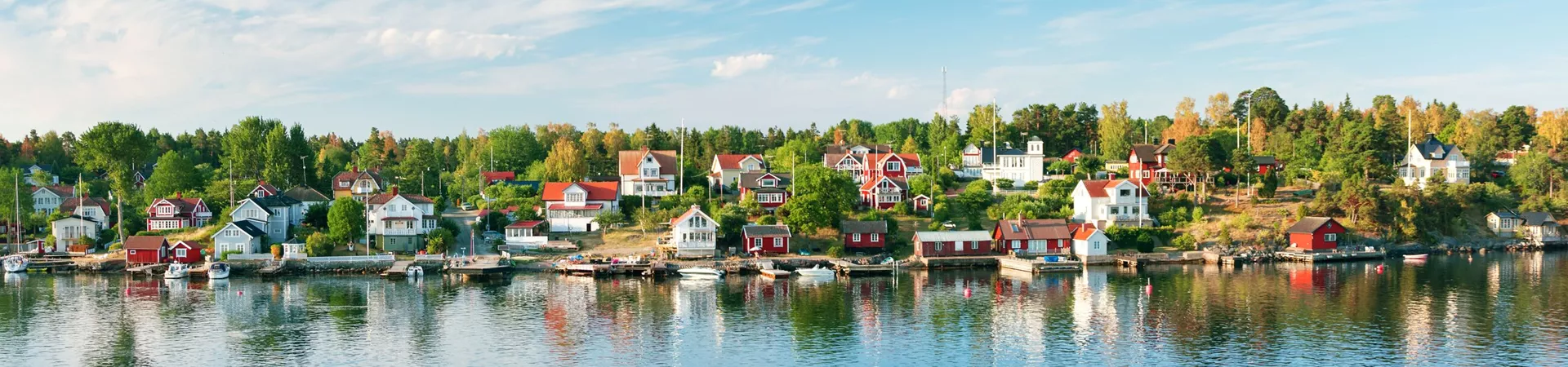 Small islands in the morning near to Stockholm. Swedish landscape with traditional red houses