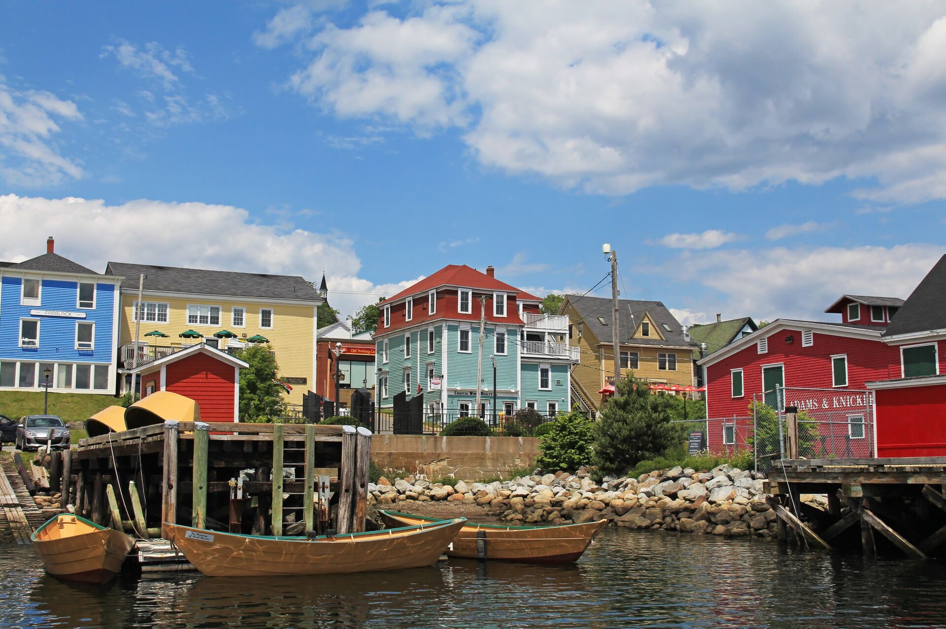 Lunenburg In Nova Scotia, Canada Colorful Buildings And Dories In The Harbor Front 578348620