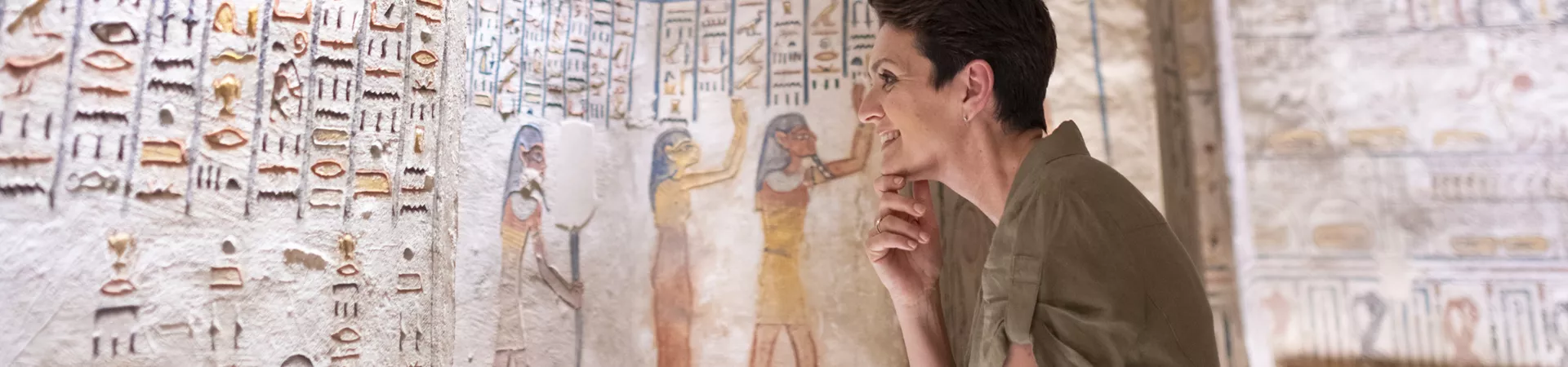 Lady on Egypt tour looking at ancient drawings