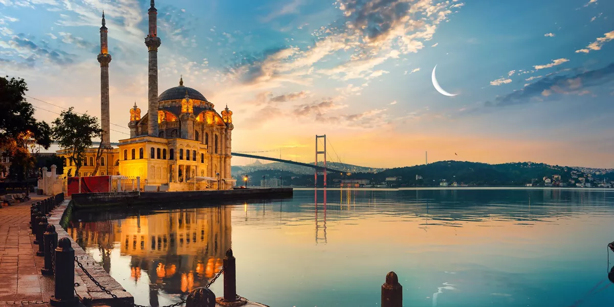 Mosque and Bosphorus Bridge at sunset in Istanbul, Turkey