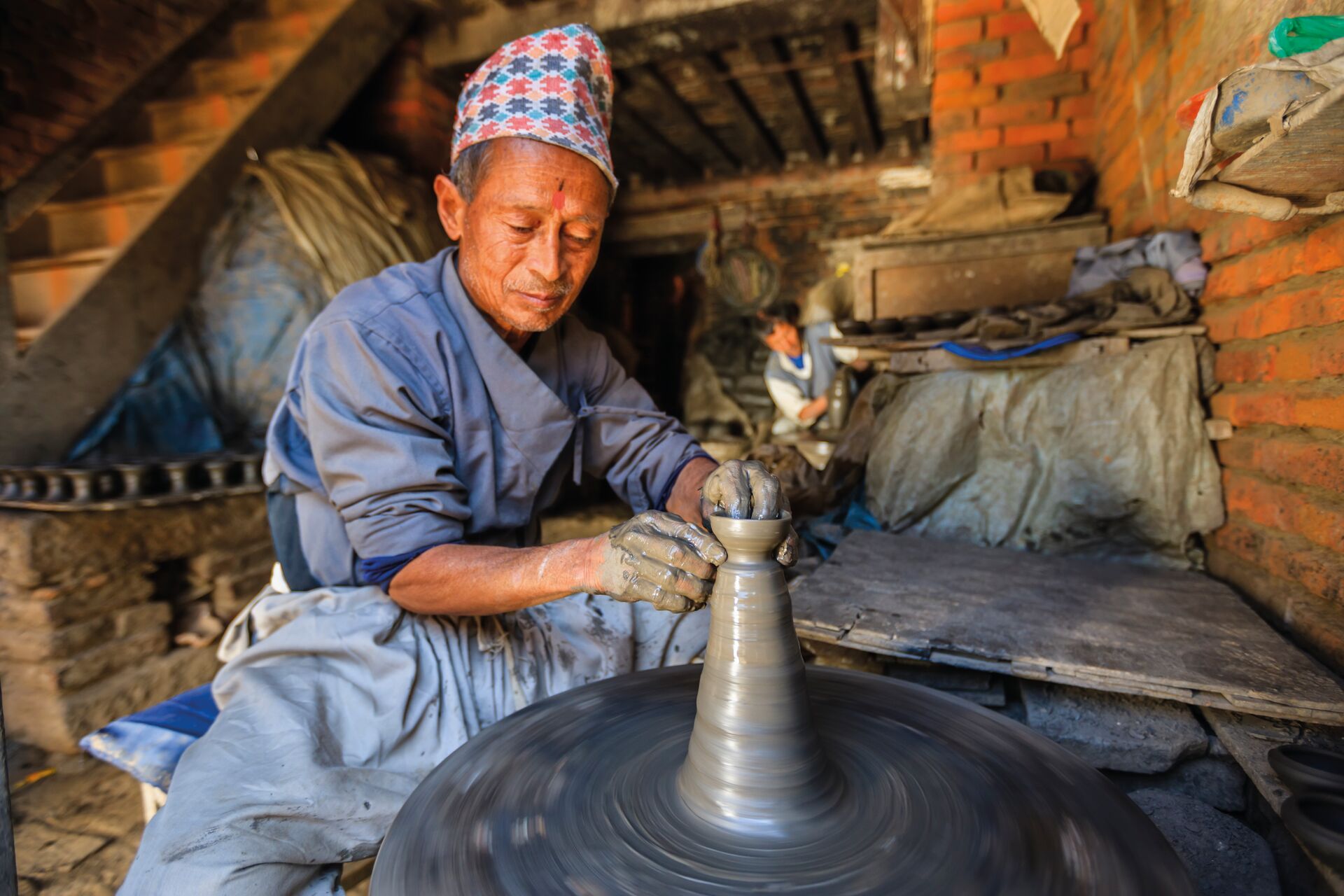 Nepali potter working in his workshop in Nepal