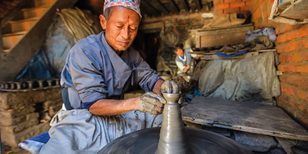 Nepali potter working in his workshop in Nepal