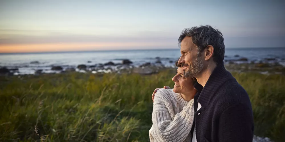 A couple look out to sea