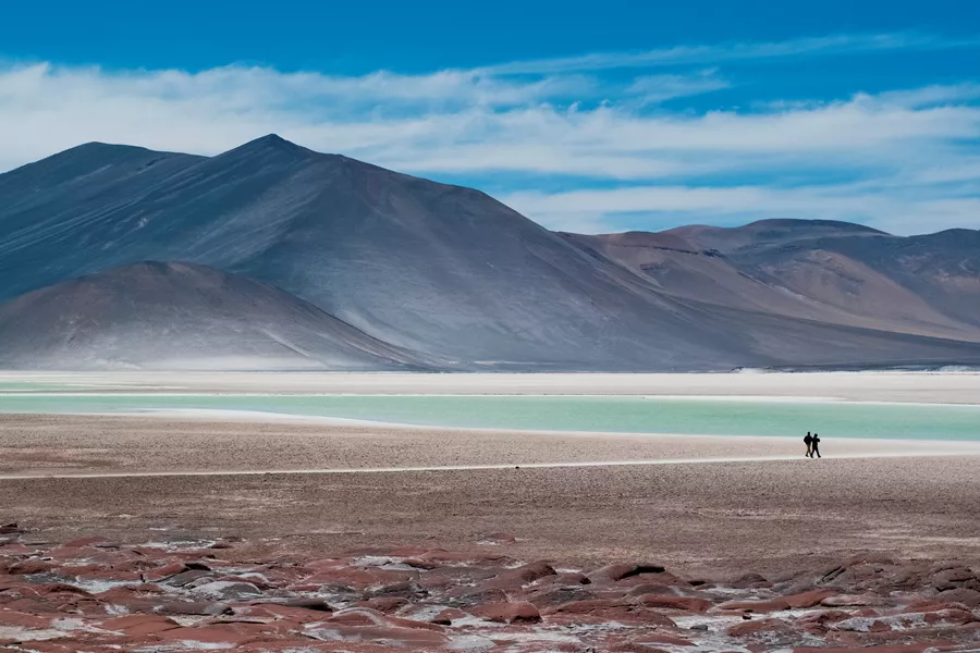 Silhouette Of Two People By Lakes At Piedra Rojas On Altiplano In Atacama Desert, Chile 1341435613