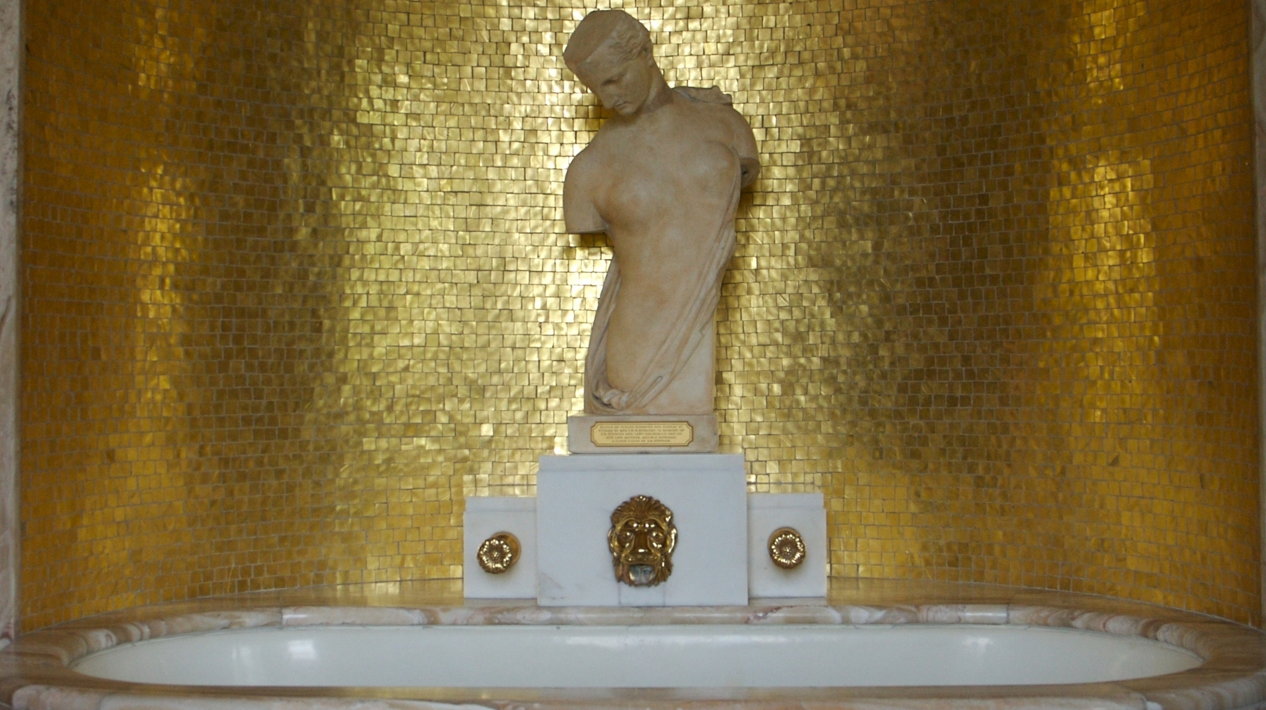 Virginia's-bathroom-with-a-statue-of-Psyche-and-a-gold-moasic-taile-designed-by-Peter-Malcrida
