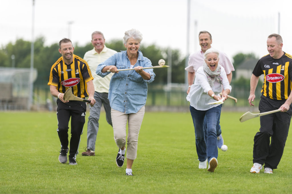 Insight Vacations guest enjoying a hurling lesson - an ancient Irish sport