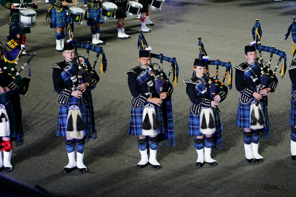 Scottish bagpipers standing in a line