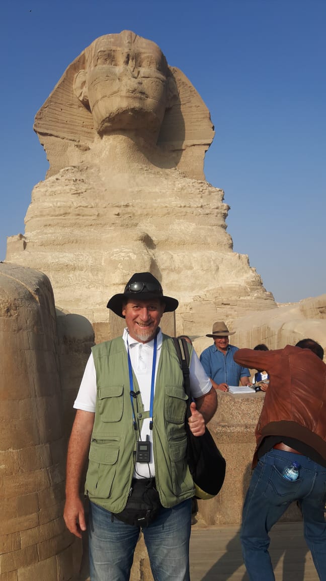 Image of Travel Director Hani in from of the Great Sphinx in Egypt.
