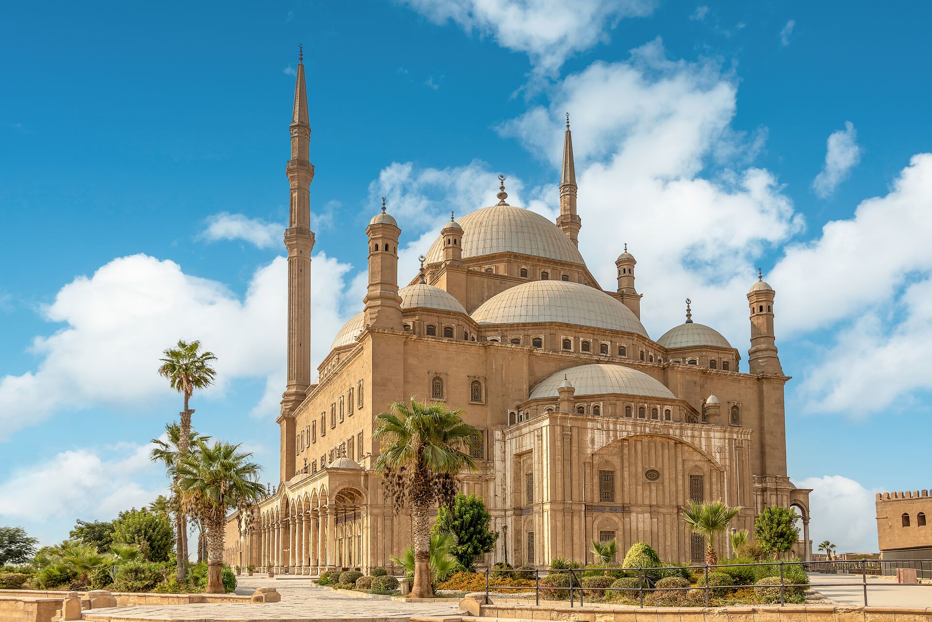 Mosque of Muhammad Ali, Cairo, Egypt against a bright blue sky, showing the detailed architecture
