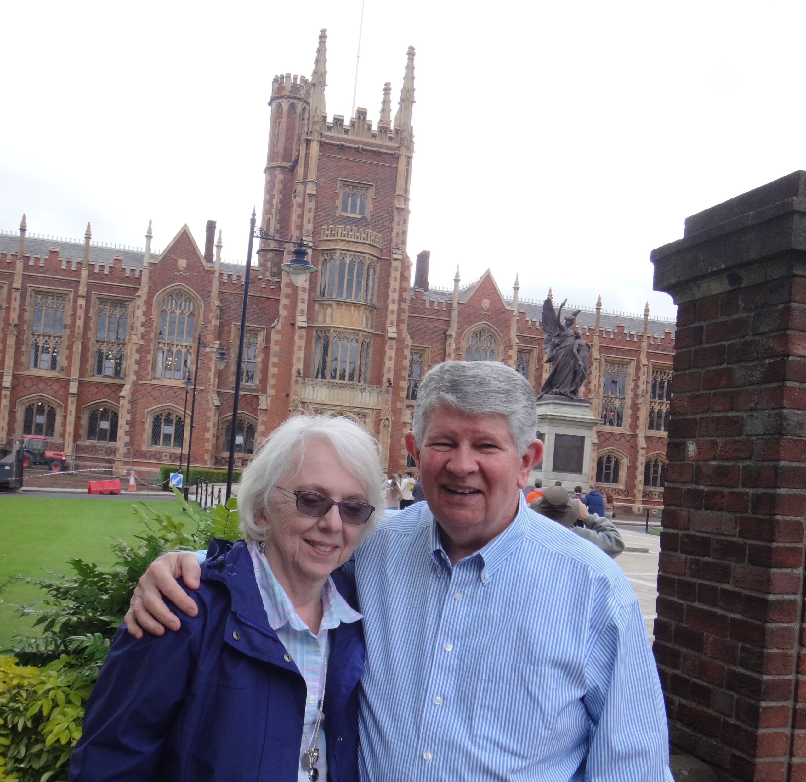 Sue & David Cain, pictures in front of a historical building in Dublin, arms around each other and smiling