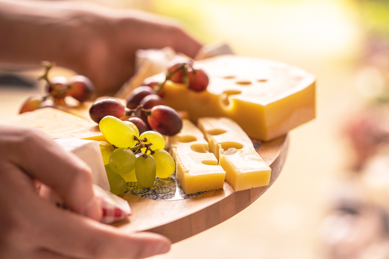 Closeup of Swiss cheese platter with grapes