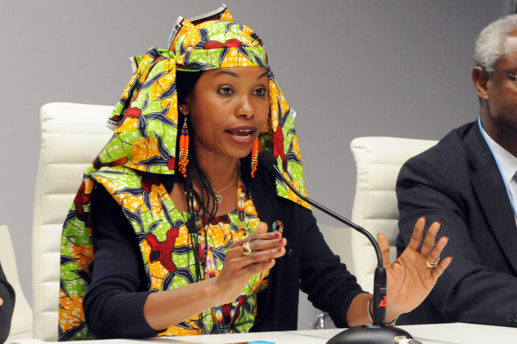 A female activist wearing a colorful head scarf.