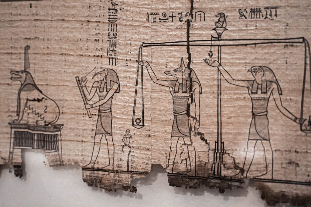 An ancient sheet of papyrus with a drawing of Egyptian gods