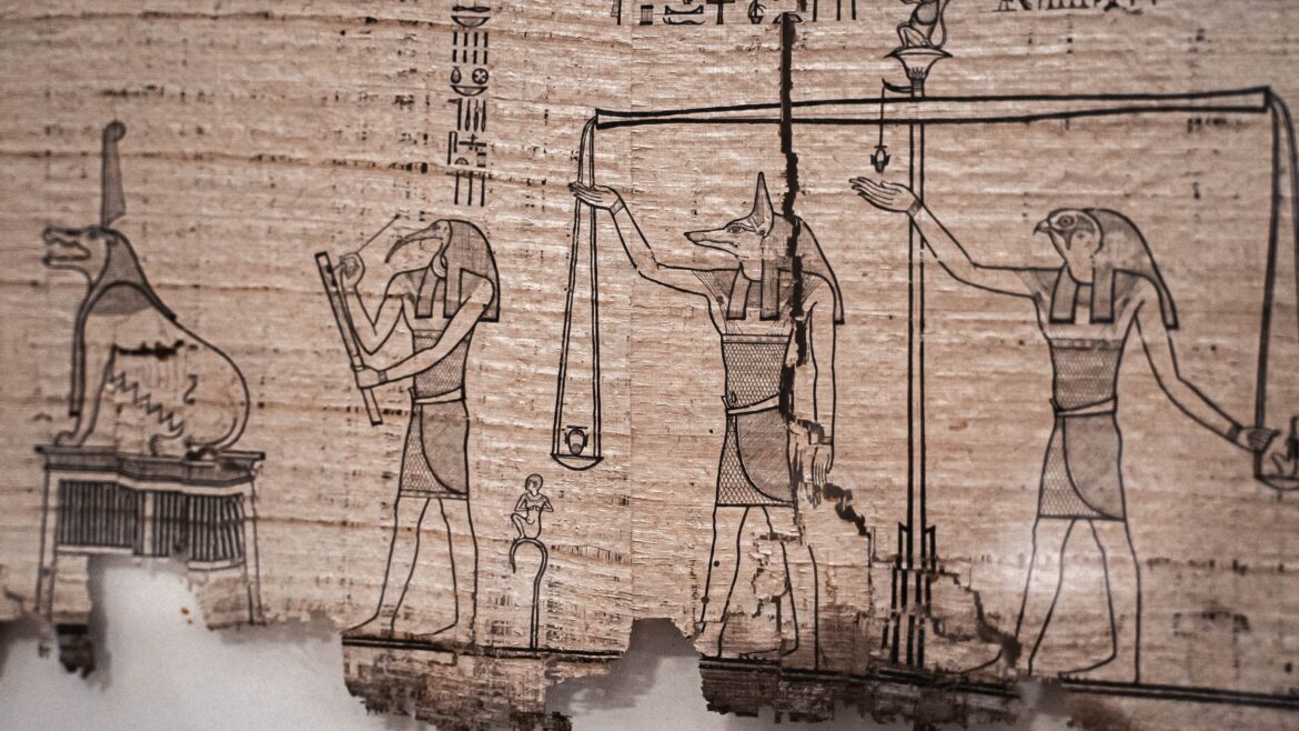 An ancient sheet of papyrus with a drawing of Egyptian gods